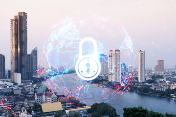 Padlock icon hologram over panorama city view of Bangkok to protect business in Asia. The concept of information security shields. Double exposure.