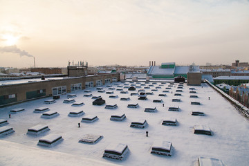 Rooftop of industrial building covered with snow in Saint Petersburg