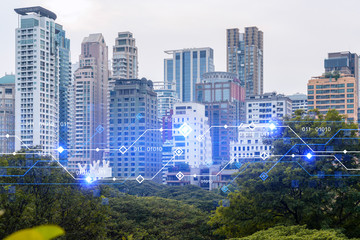 Fototapeta na wymiar Technology hologram over panorama city view of Bangkok. The largest tech hub in Asia. The concept of developing coding and high-tech science. Double exposure.