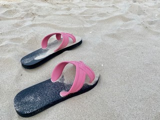 pink slipper on the beach