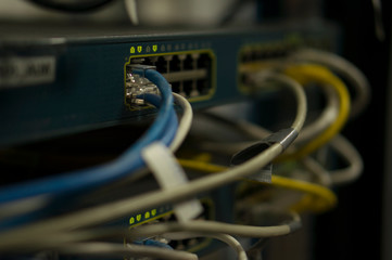 Closed data center Internet provider. Cable and switch connections. High speed internet network....