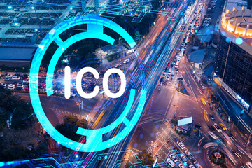ICO icon hologram on aerial view of road, busy urban traffic highway at night. Junction network of...