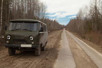 Fototapeta na wymiar Soviet minibus on a dirt road
