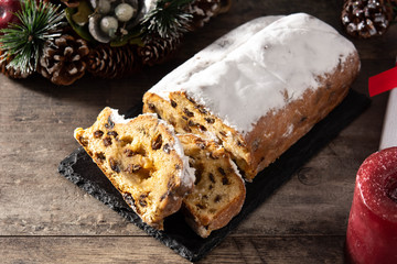 Christmas stollen fruit cake on wooden table	
