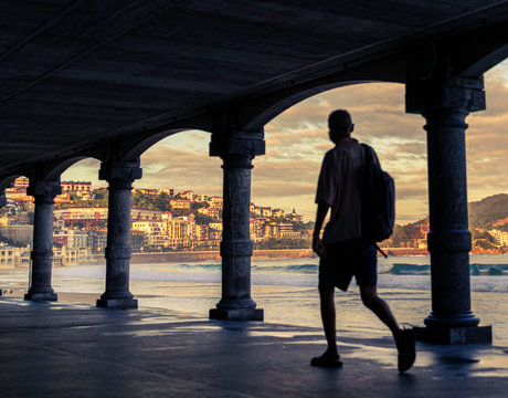 first lights of day in the arcades of la cocha beach in san sebastian, spain