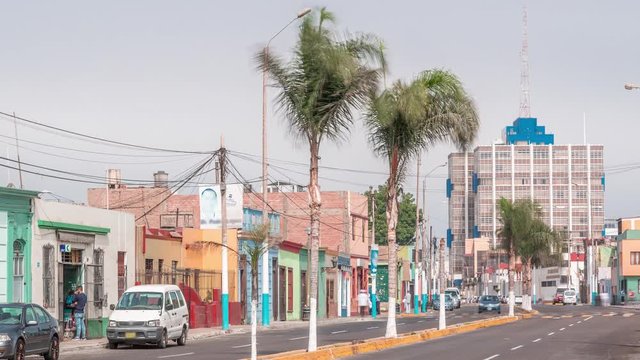 Monumental Callao is one of the new fashion areas near Lima timelapse. Gamara street traffic with colorful houses and restaurants. Lima Peru.