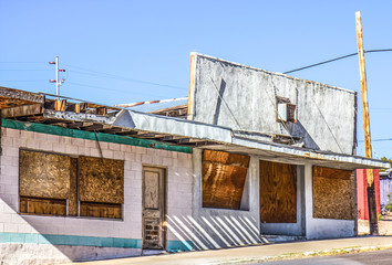 Abandoned Commercial Building With Boarded Up Windows