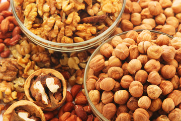 Different nuts in glass cups