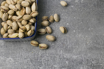 pistachio nuts on a wooden table