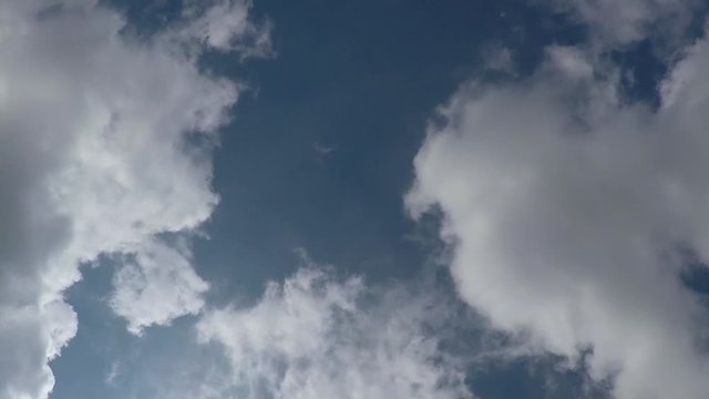 time lapse of white clouds on sunny blue sky timelapse
