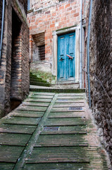 Fototapeta na wymiar Old Italian front door in Urbino town, Italy