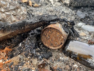 close up ash and can on the ground