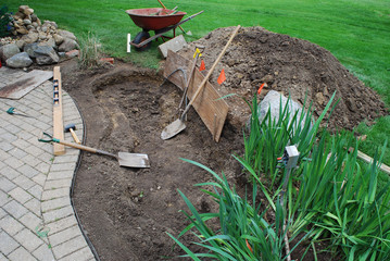 Creating a pond and waterfall project in the backyard off the patio