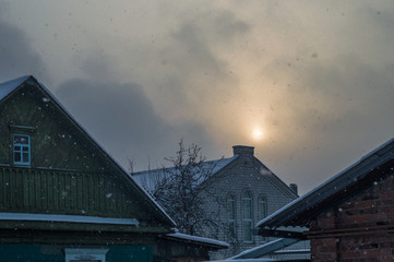 Sun breaks through the clouds, gothic house in the foreground. High quality photo