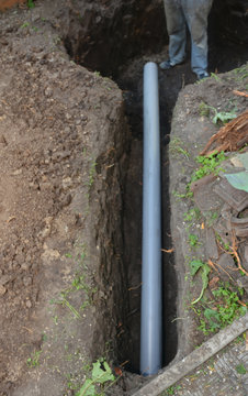 Installation Of Main Drain Pipe, Sewer Waste Line, Septic Pipe In A Trench.