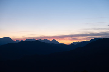 Epic sunset lights with clouds in a mountain landscape