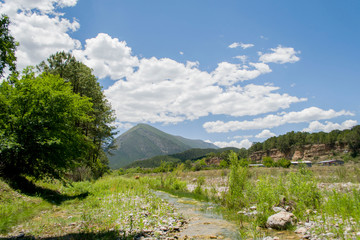 Fototapeta na wymiar river with stones and mountains