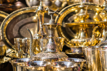 Fototapeta na wymiar A display of decorative brass objects reflecting light
