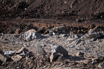 Soil and stone background. Grey stones. Grunge earth background.