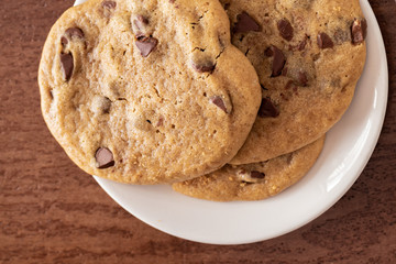 chocolate chip cookies on a white plate 