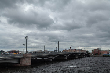 Fototapeta na wymiar Saint Petersburg cloudy cityscape. Annunciation Bridge.