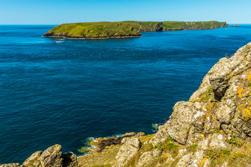 Skomer Island (breeding ground for Atlantic Puffins) from Wooltack Bay on the mainland in early summer