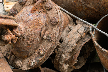 Heap of old aged useless rusty rough and rotten water pipes