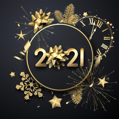 Golden 2021 sign with gold bow on dark background.