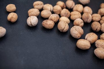 Hazelnuts on the black border. Background for the text