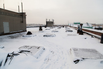 Rooftop of industrial building covered with snow in Saint Petersburg