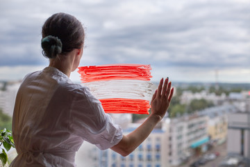 Day of the proclamation of the Republic of Latvia November 18th. Patriotic drawing on the window. Pride honor. patriotism elections. Flag white red. Woman voting. Austria Nationalfeiertag October 26