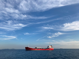 cargo ship on sea with amazing blue sky