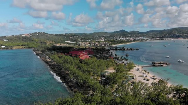 Drone flying over the inlet of the southern tip of St. Lucia on a stunning sunny day.
