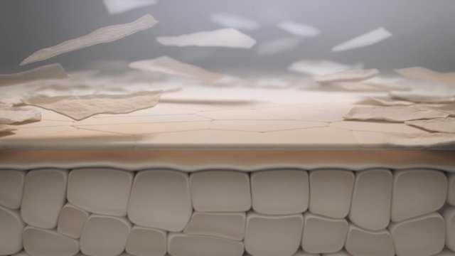 Dead skin cells peeling away from skin surface, macro animation side camera movement.