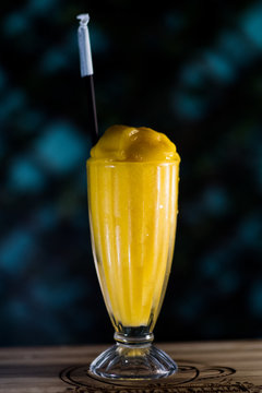 Vertical Shot Of A Yellow Smoothie