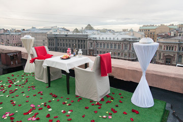 Rooftop table served for a romantic dinner