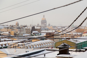 Fototapeta na wymiar Rooftop cityscape of Saint Petersburg in winter time wit view on Saint Isaac's cathedral