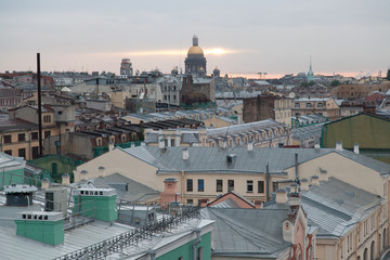 Fototapeta na wymiar Saint Petersburg rooftop cityscape in time of sunset with view on Saint Isaac's cathedral
