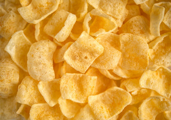 Junk food. Crispy golden crisps. Foodbackground
