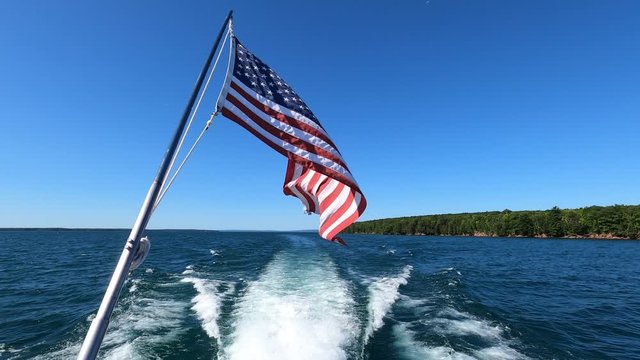 United States of America Flag waving. Cruising the Lake Superior in Northern Wisconsin. Boat tour, local tourism