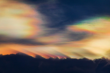 Beautiful iridescent cloud, Irisation. Skyscraper background.