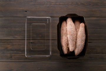 Kebab Chicken frozen in a tray on a wooden background