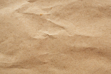 Brown crumpled paper recycled kraft sheet texture background