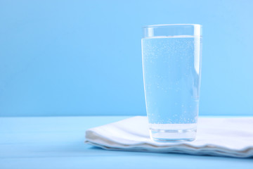 Clear water in a glass and bottle on the table