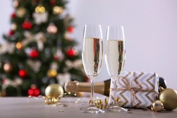 glasses with champagne on the table. Background with place for text for the new year holiday
