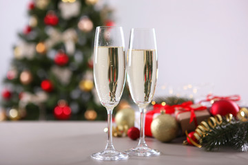 glasses with champagne on the table. Background with place for text for the new year holiday