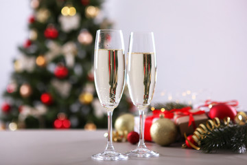 glasses with champagne on the table. Background with place for text for the new year holiday