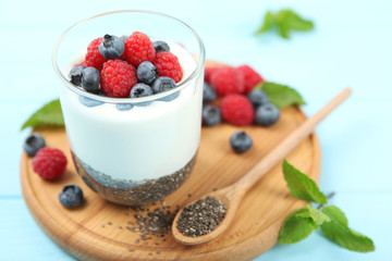 chia pudding with natural yogurt and fresh berries close-up on the table.
