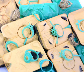 Silica rubber molds, silver molds, many green and blue wax rings, used in the manufacture of jewelry in the jewelry industry.