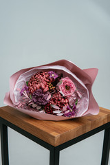 Bouquet of flowers in pink package